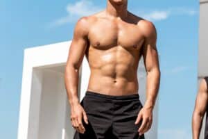 A man's well-defined, contoured chest and abs from liposuction in San Antonio, TX