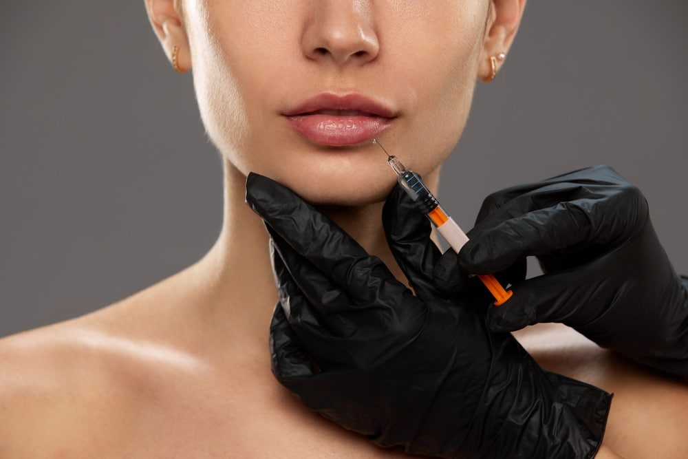 Lip,Augmentation.,Cropped,Image,Of,Female,Face,,Woman,Doing,Lip