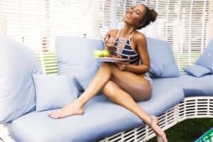 Woman,Relaxing,At,Beach,Enjoying,Summer,Freedom,With,Open,Arms