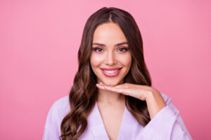 Woman's face smiling, looking youthful after facelift in San Antonio, TX