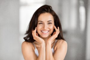 Woman smiling looking refreshed after getting dermal filler injections in San Antonio, TX